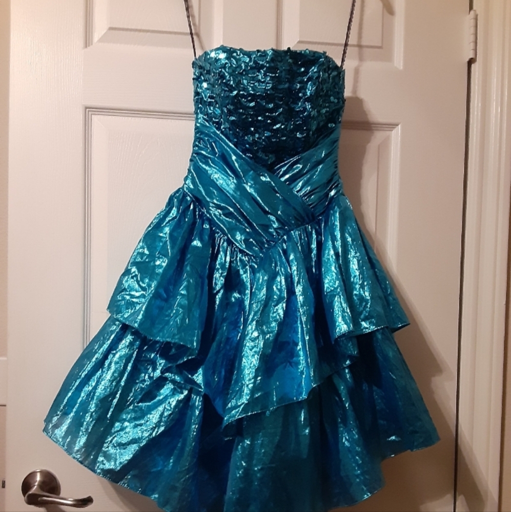 Three dresses. The first sold by itself. The other two together. Sizes 3,size M